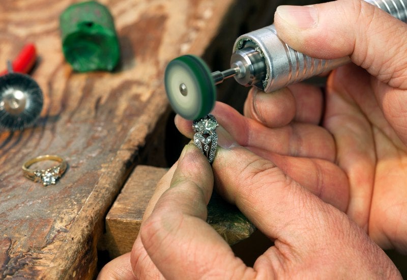 Man Polishing a Diamond Ring in Houston, TX