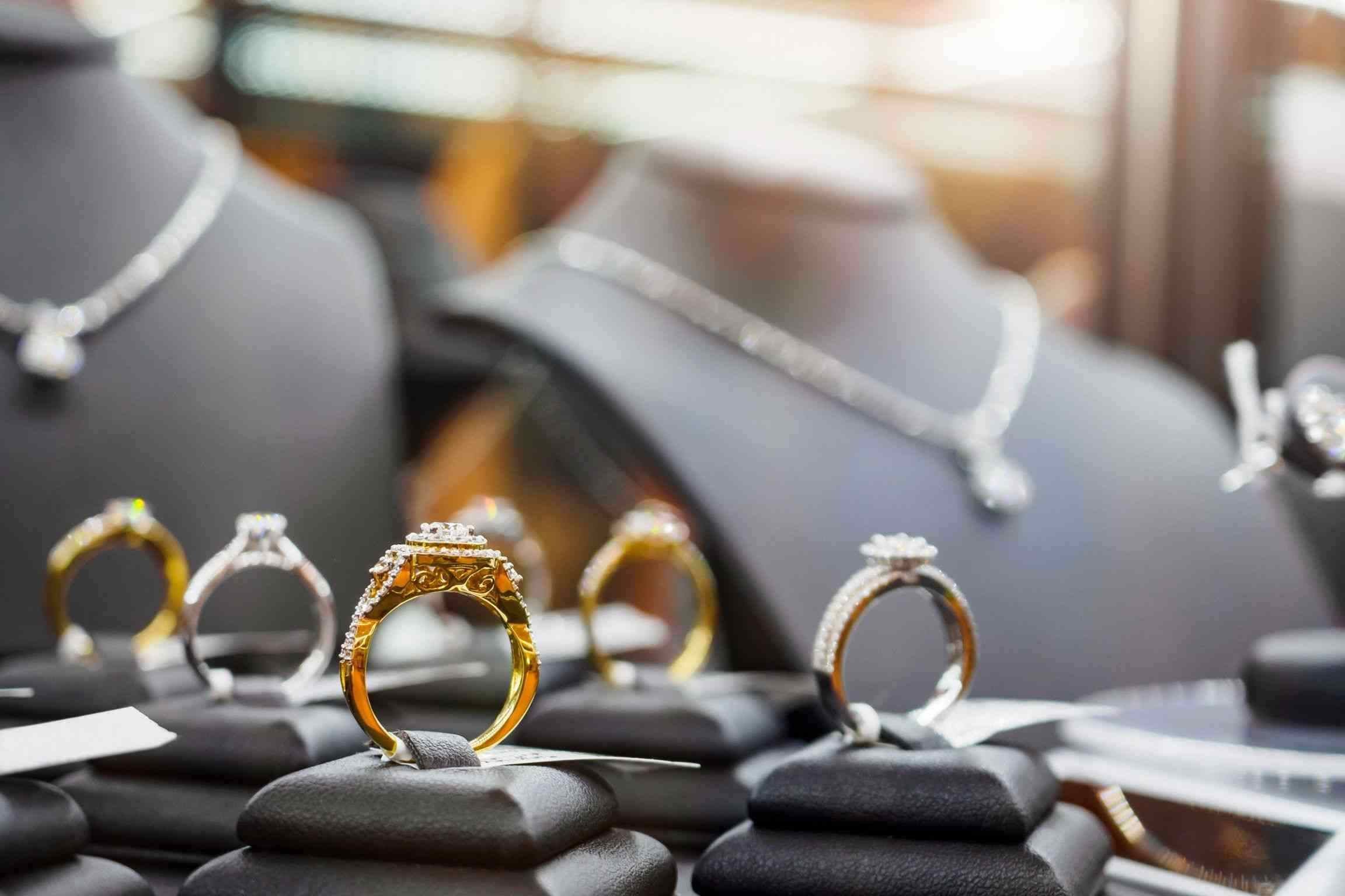 A display of various rings and necklaces showcased in a jewelry store in Houston, TX