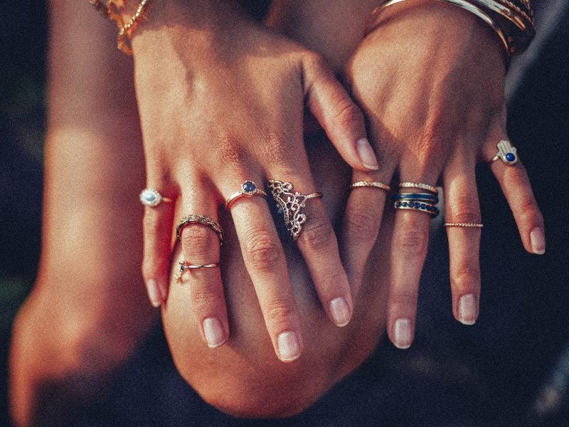 Boho girl's hands with rings